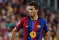 Rodri mengungkap perbedaan metode Pep Guardiola dan Hansi Flick, termasuk pola latihan gym dan pendekatan match fitness. (AP Photo/Joan Monfort)